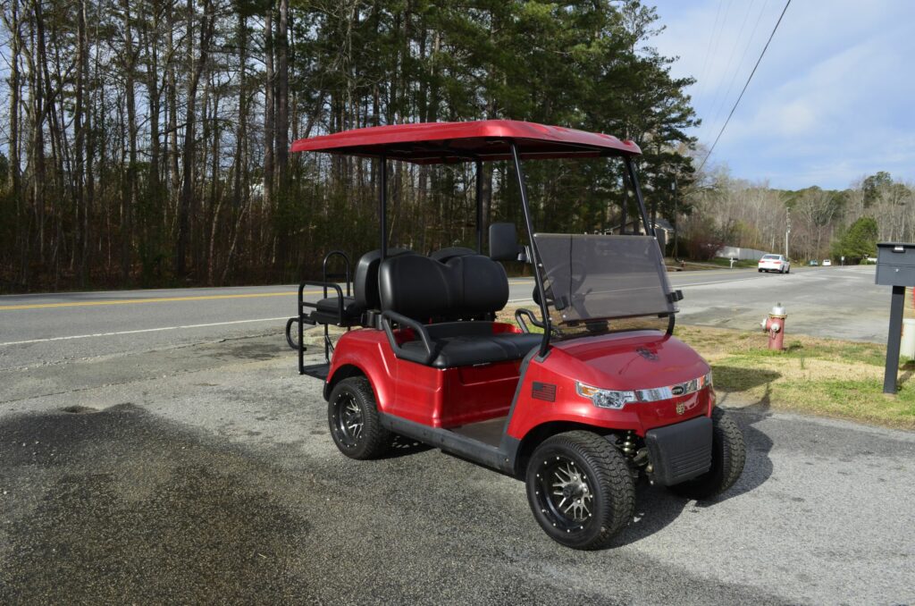 Side View of a STAR Capella Golf Cart in Candy Apple Read at J's Golf Carts